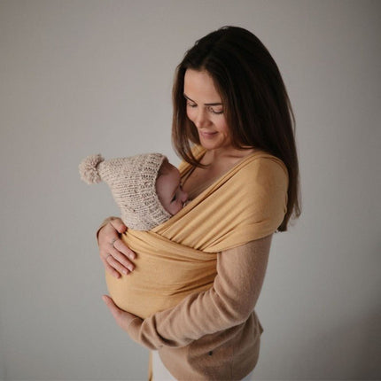 Mushie Draagdoek Mustard Melange koop je bij Babywinkel