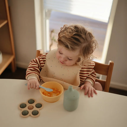 Mushie Slabbetje Silicone Vanille Confetti koop je bij Babywinkel